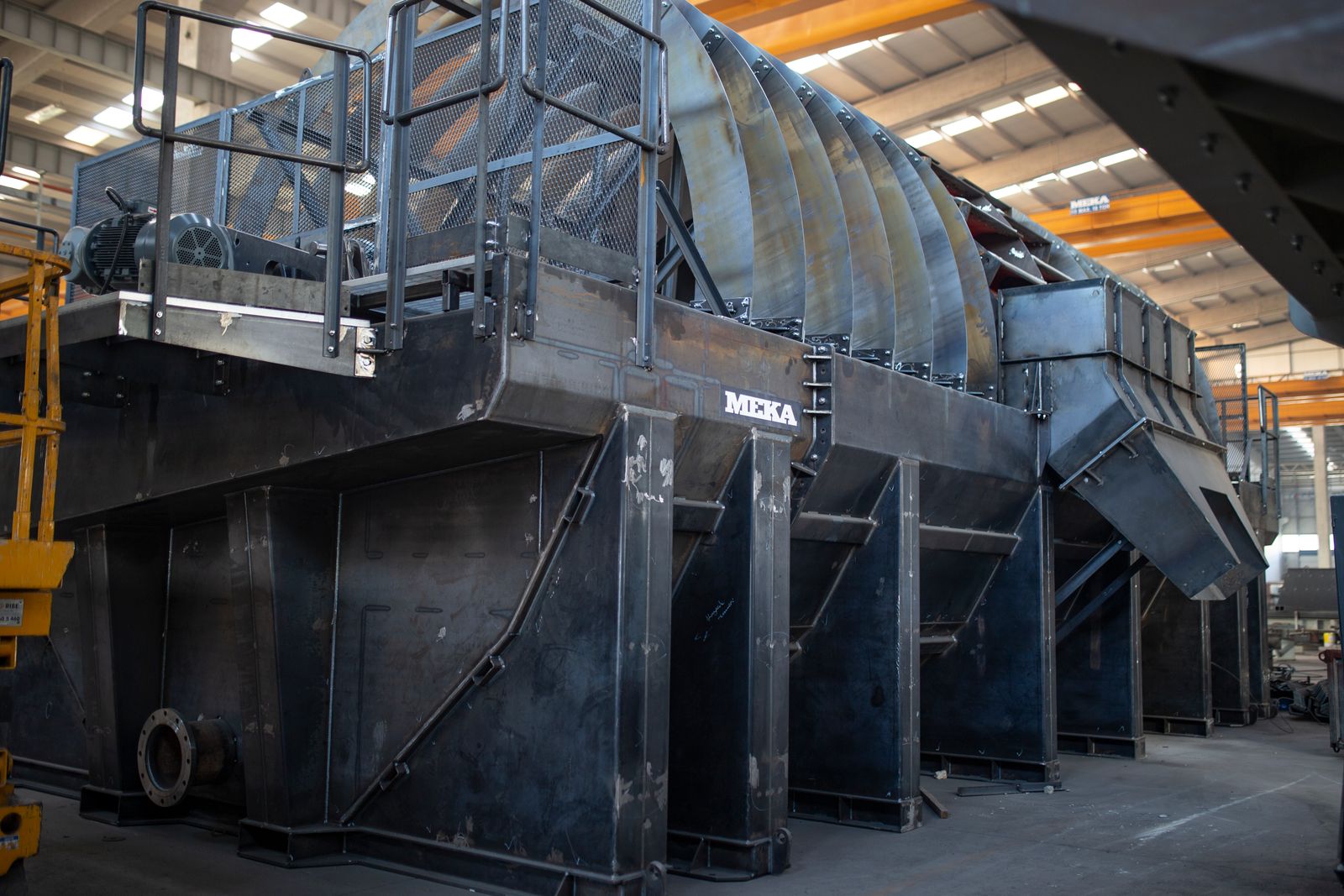 Large fabricated heavy equipment on the floor of the Manufacturing Stars production facility